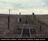 View from a westbound train at the west switch of the Ralston, WA siding (Bauman Road grade crossing) in 1979, probably the train led by MILW 24 in another photo.