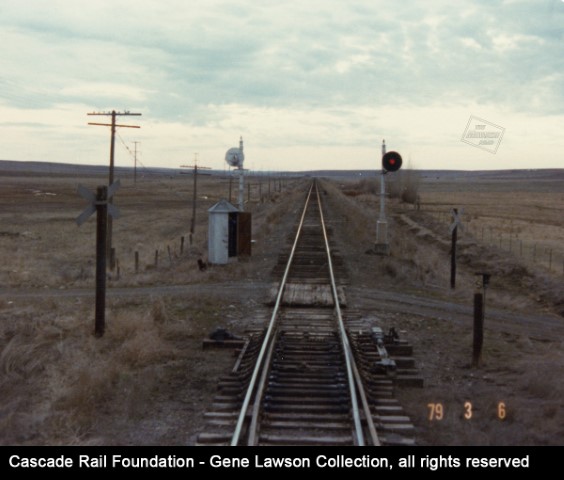 View from a westbound train at the west switch of the Ralston, WA siding (Bauman Road grade crossing) in 1979, probably the train led by MILW 24 in another photo.